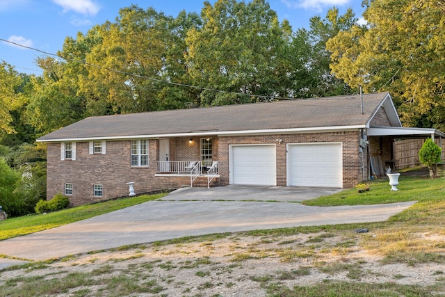 view of front of home featuring a front yard, a porch, and a garage