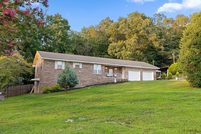 ranch-style home with a garage and a front lawn