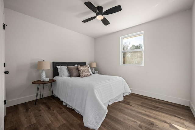 bedroom featuring ceiling fan and dark wood-type flooring