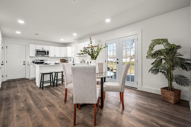 dining area featuring dark hardwood / wood-style flooring and french doors