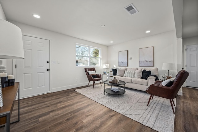 living room with dark hardwood / wood-style floors