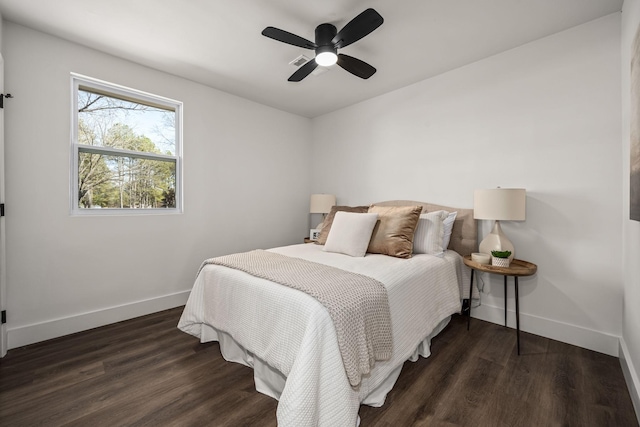 bedroom featuring ceiling fan and dark hardwood / wood-style floors