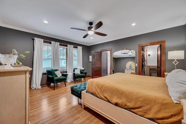 bedroom with ceiling fan, crown molding, and light hardwood / wood-style floors