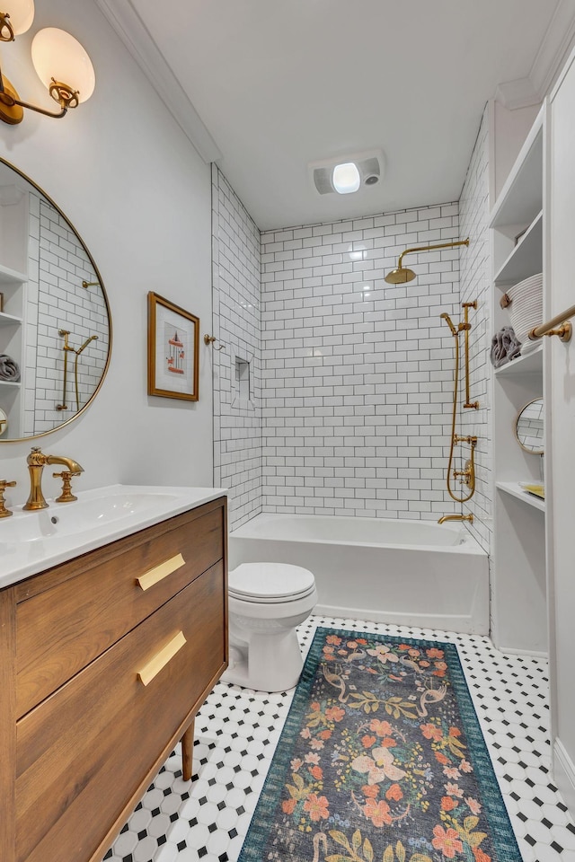 full bathroom featuring tile patterned flooring, vanity, toilet, and tiled shower / bath