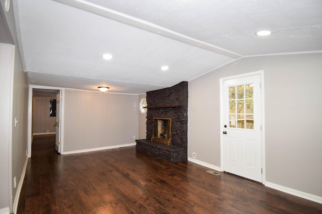 unfurnished living room featuring a fireplace, lofted ceiling, and dark wood-type flooring