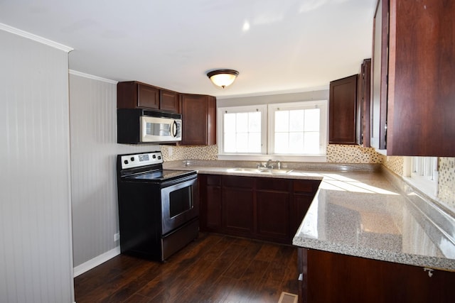 kitchen featuring sink, electric range, dark hardwood / wood-style floors, light stone countertops, and ornamental molding