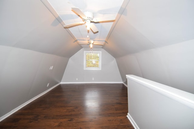 additional living space featuring ceiling fan, dark hardwood / wood-style flooring, and vaulted ceiling