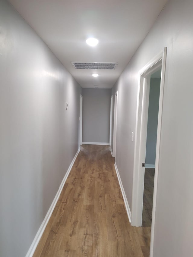 hall with light hardwood / wood-style floors