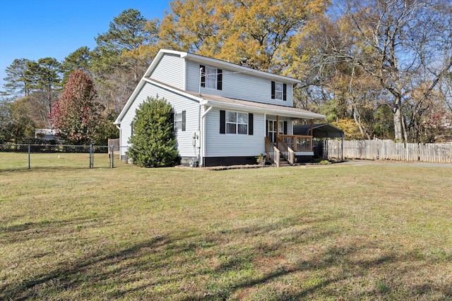 back of house with a yard and a carport