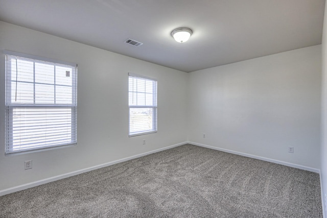 spare room with carpet flooring