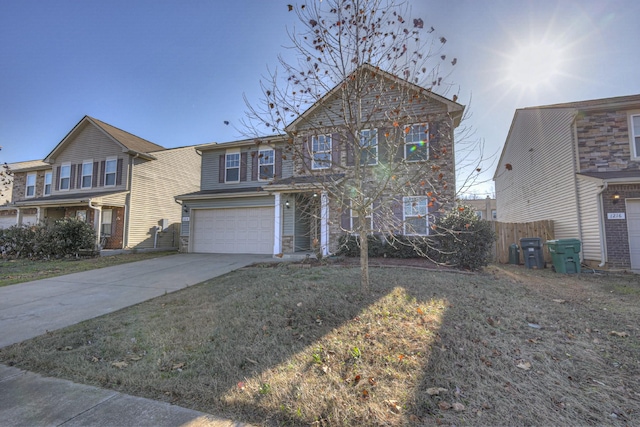 view of front of home with a front yard and a garage