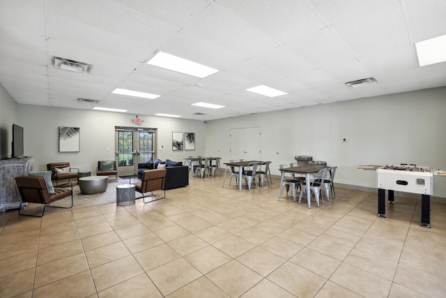 interior space with french doors and light tile patterned floors