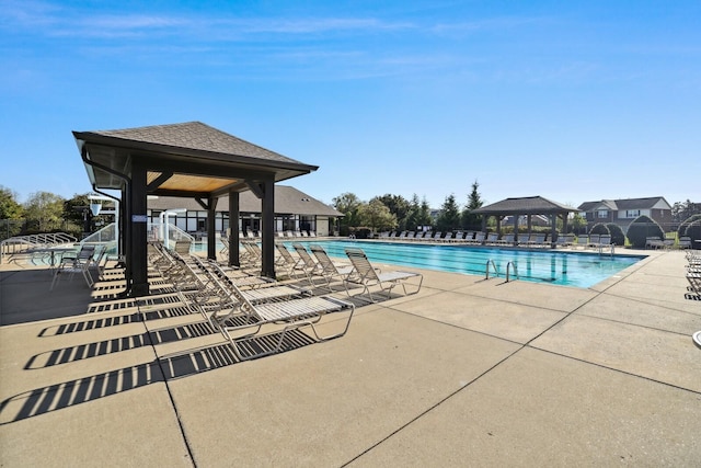 view of swimming pool with a gazebo and a patio