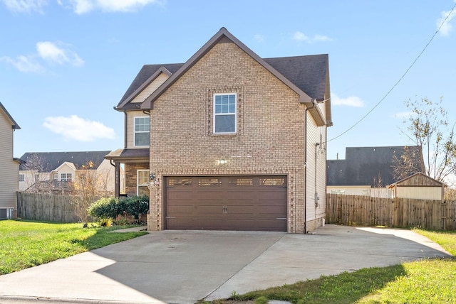 front of property featuring a garage and cooling unit