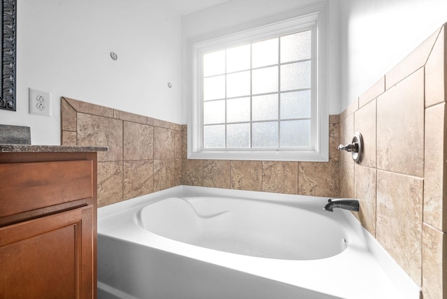 bathroom featuring a bathtub and vanity