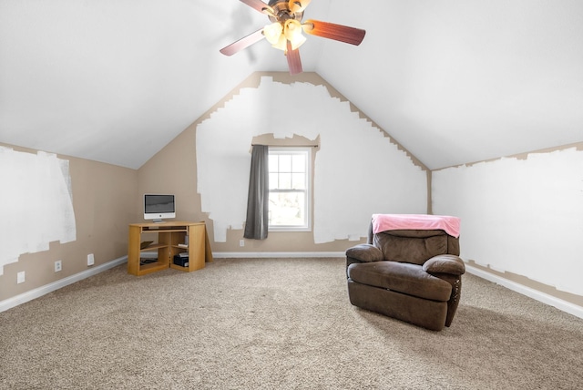 sitting room with ceiling fan, carpet, and vaulted ceiling