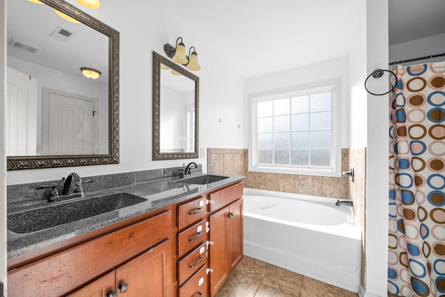 bathroom with tile patterned flooring, vanity, and separate shower and tub