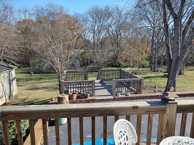 deck featuring a lawn