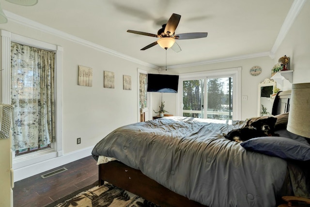 bedroom with dark hardwood / wood-style flooring, ceiling fan, and crown molding