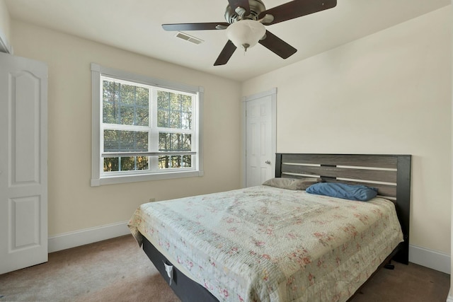 carpeted bedroom featuring ceiling fan