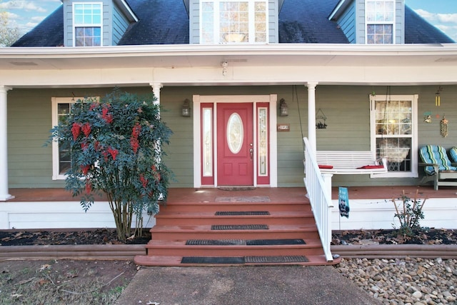 property entrance with covered porch