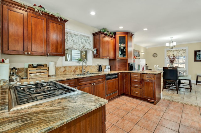 kitchen with pendant lighting, sink, ornamental molding, tasteful backsplash, and kitchen peninsula