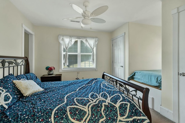 carpeted bedroom with ceiling fan