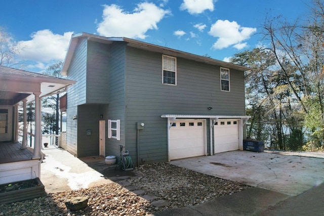 back of house with a garage