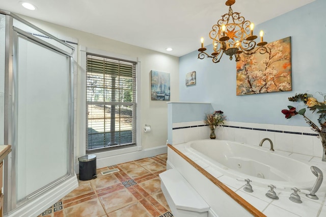 bathroom with tile patterned floors, plus walk in shower, and a notable chandelier