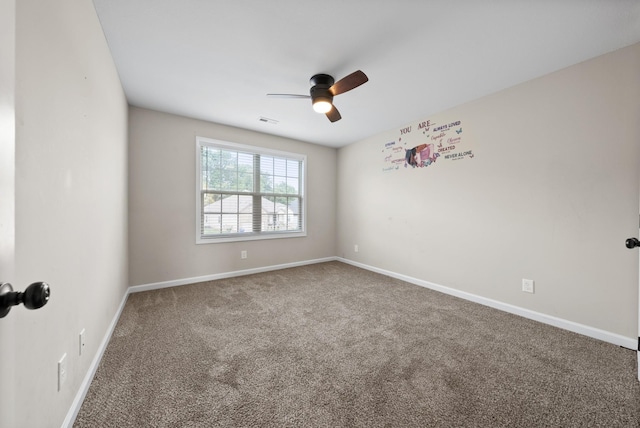 unfurnished room with carpet flooring and ceiling fan