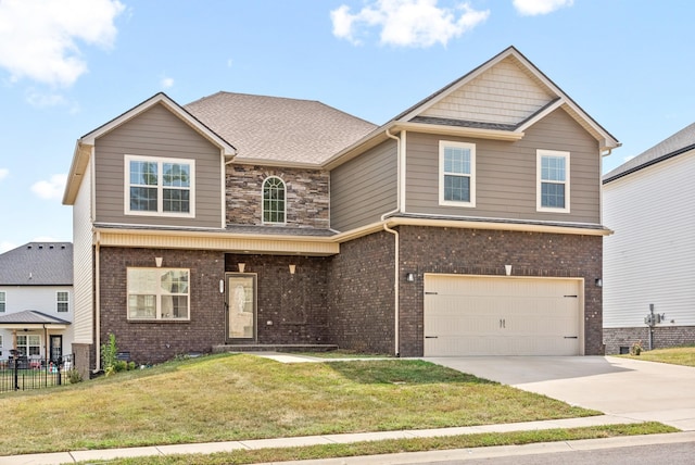 view of front of property featuring a front yard and a garage