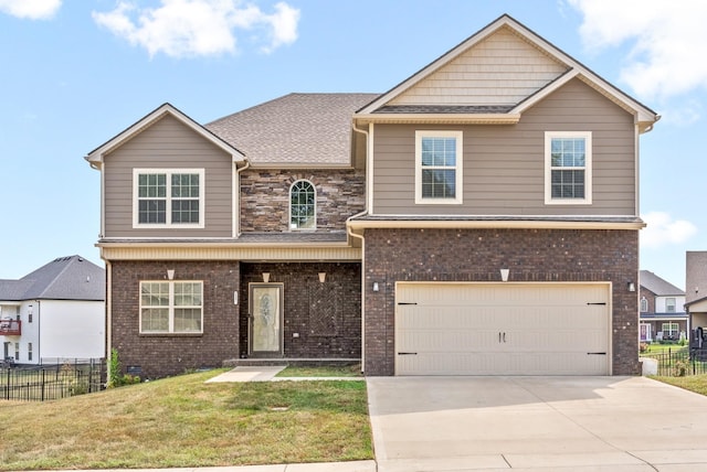 view of front of property with a garage and a front lawn