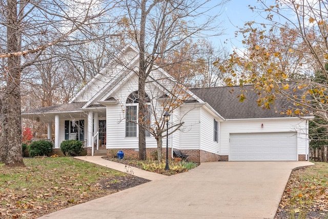 view of front facade featuring covered porch and a garage