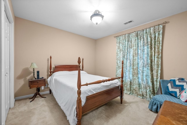 carpeted bedroom with a closet