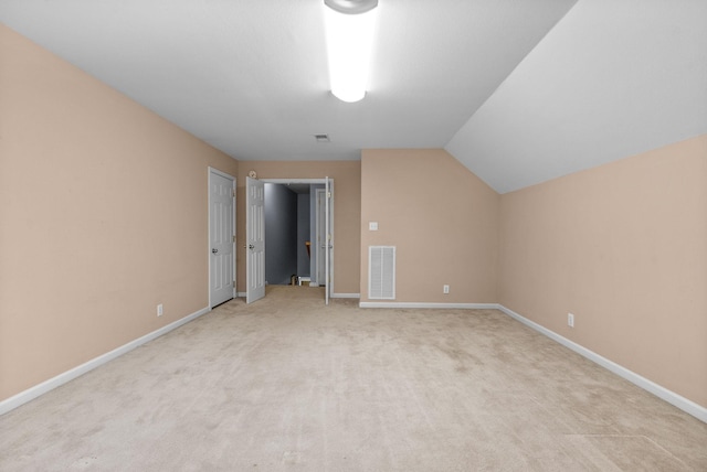 bonus room featuring carpet and lofted ceiling