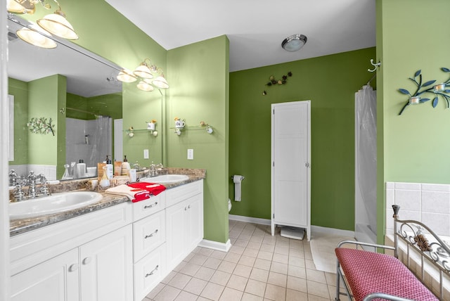 bathroom featuring tile patterned floors, plus walk in shower, and vanity