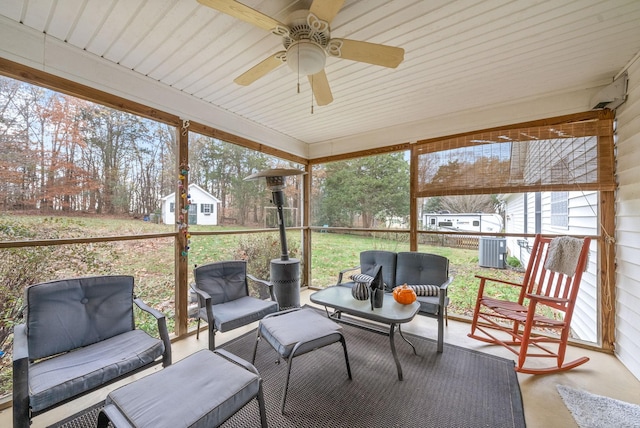 sunroom featuring ceiling fan