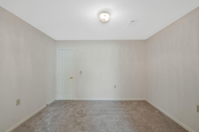 unfurnished room with light colored carpet