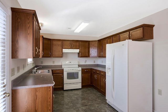 kitchen featuring white appliances and sink