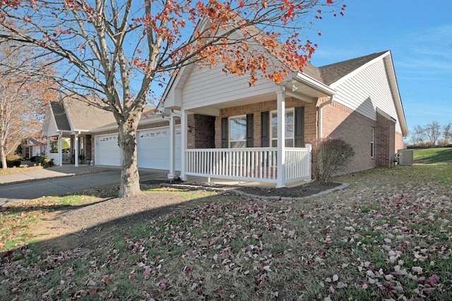 view of front of property featuring a porch and a garage