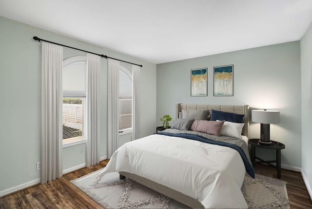 bedroom featuring dark hardwood / wood-style flooring