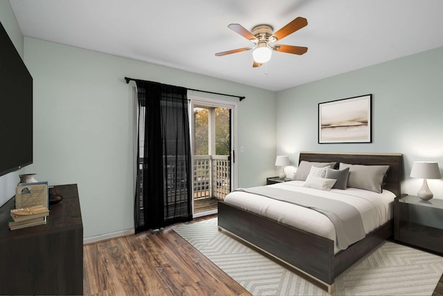 bedroom featuring ceiling fan, hardwood / wood-style floors, and access to outside