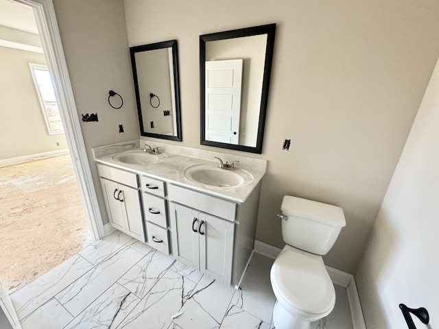 bathroom with vanity and toilet