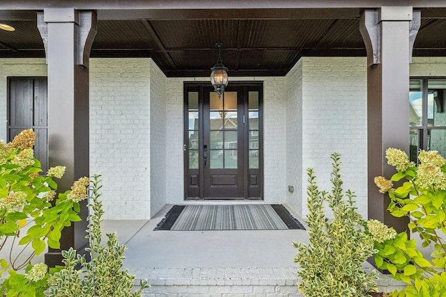 doorway to property with a porch