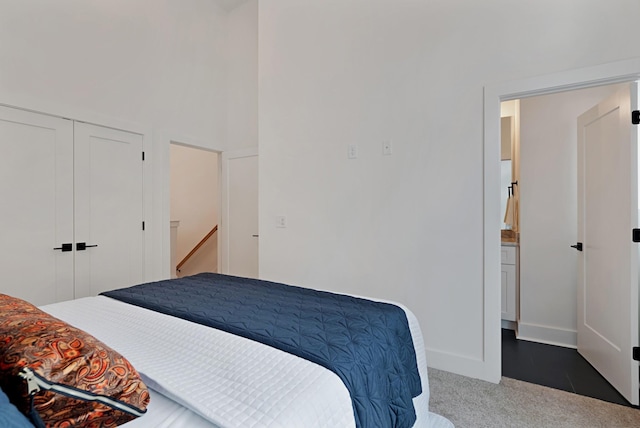 carpeted bedroom with a closet