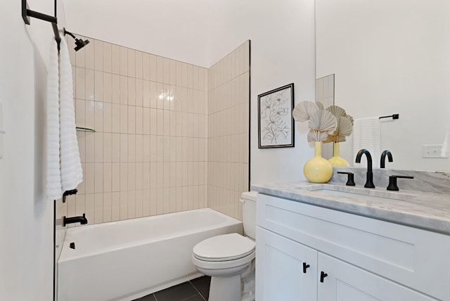 full bathroom with tile patterned flooring, tiled shower / bath combo, toilet, and vanity