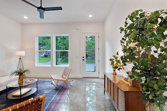 doorway to outside featuring ceiling fan