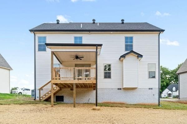 back of property with ceiling fan and a wooden deck