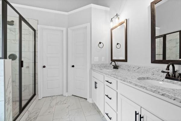 bathroom featuring vanity, an enclosed shower, and ornamental molding