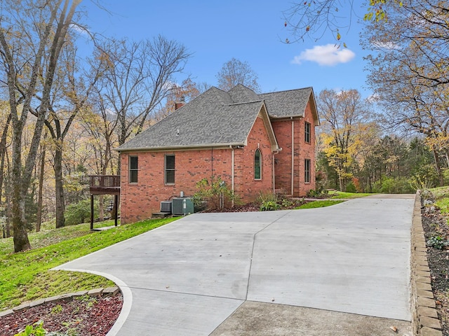 view of property exterior with central AC